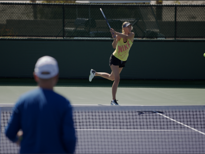 Sharapova hitting backhand with tennis coach