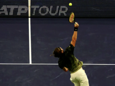 Stefano Tsitsipas hitting a serve, showcasing ISR
