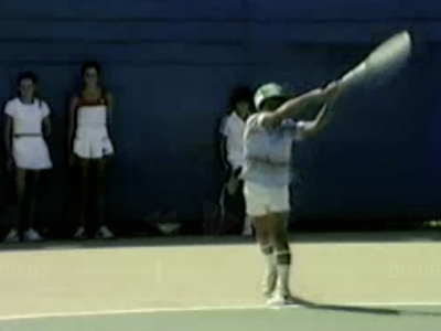 Pete Sampras as a child, hitting a forehand with an excellent forehand finish.